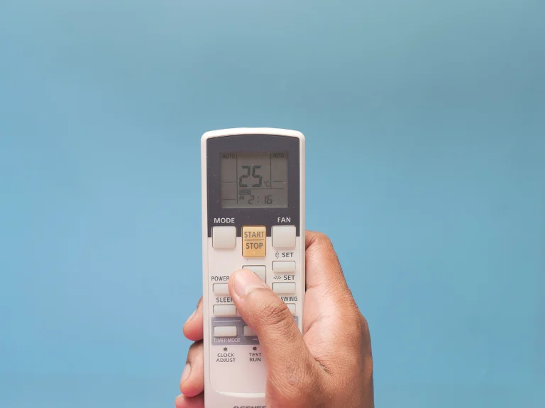 Florida homeowner using a remote to troubleshoot an AC that is running but not cooling