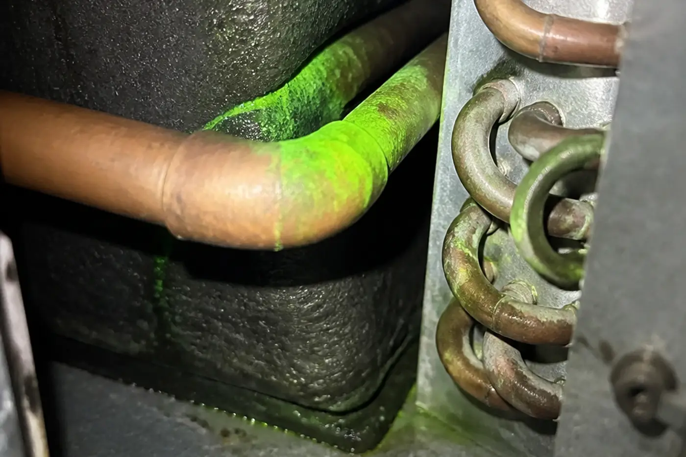 Indoor evaporator coil and copper return bends where Florida formicary leaks start