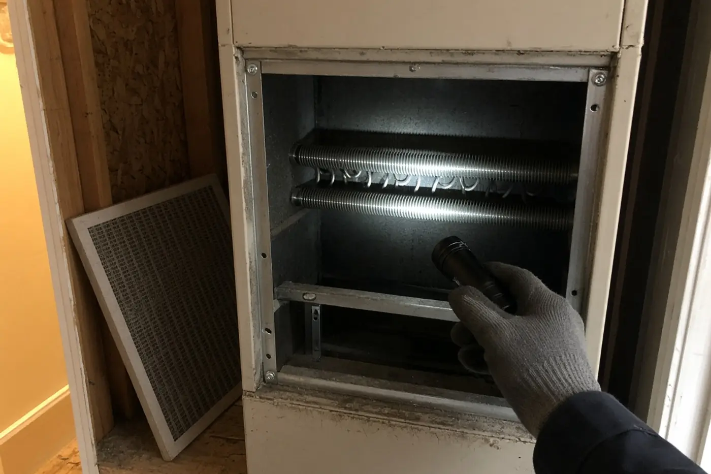 Electric heat strips inside an air handler during HVAC service in Wesley Chapel
